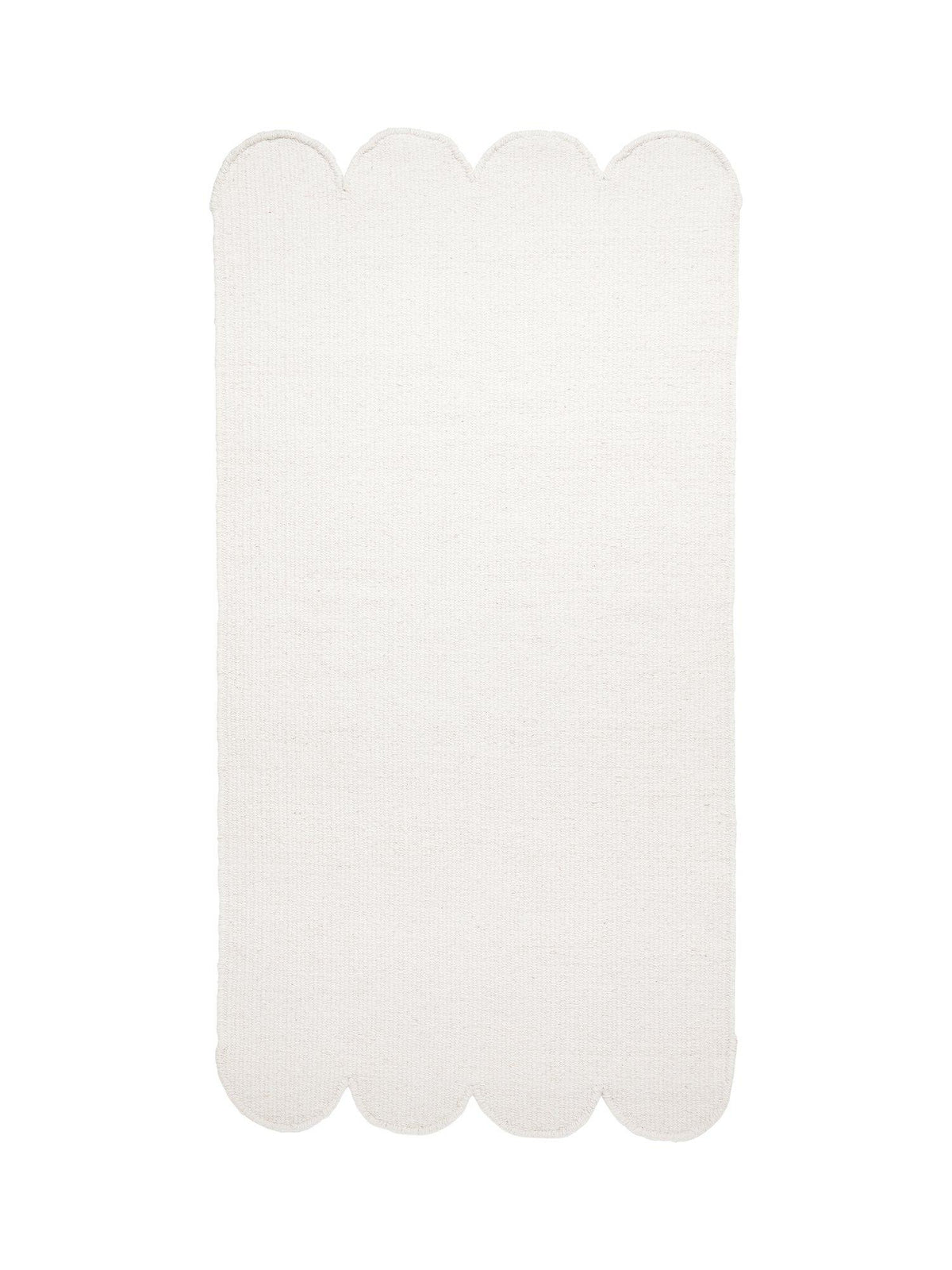 Fia ullmatta offwhite 70x140 cm med vågiga snäckskalsformade kanter