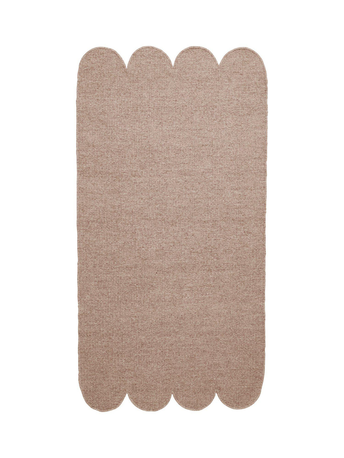 Fia ullmatta beige 70x140 cm med snäckskalsformad kant sedd uppifrån