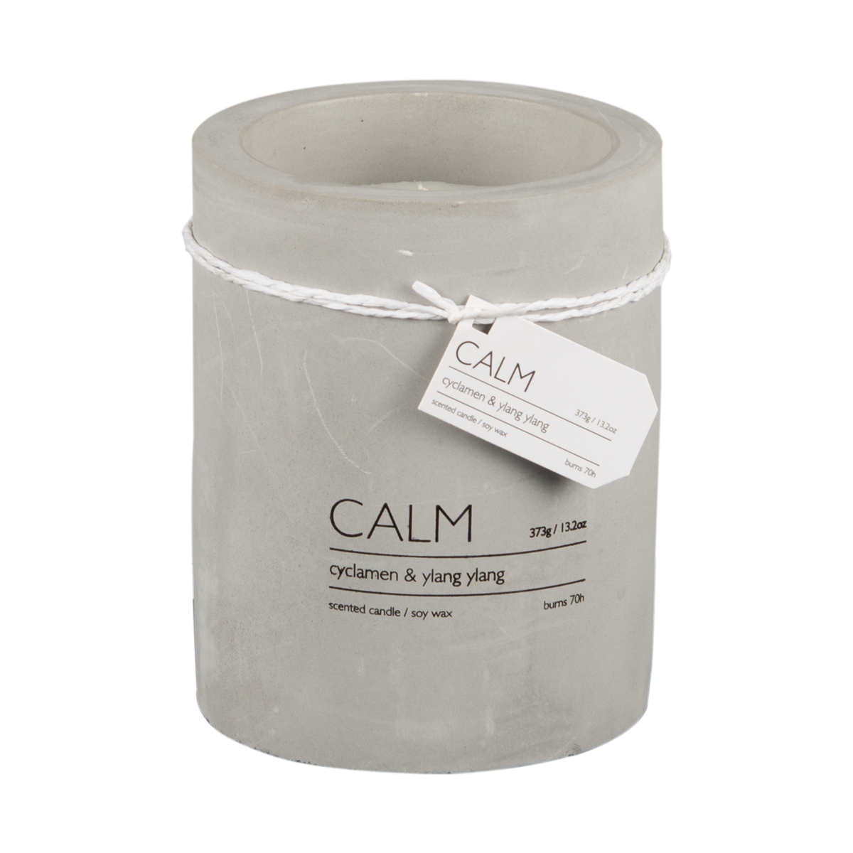 Närbild på CALM doftljus cyclamen och ylang ylang med dekorativ etikett