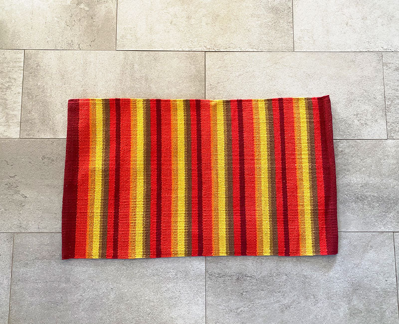 Vändbar orange matta Stripe med traditionellt randigt mönster